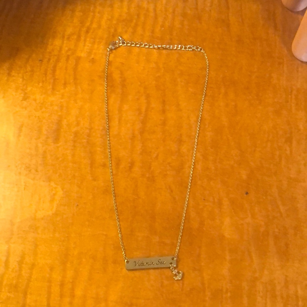 Gold vitamin sea necklace